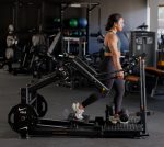 Glutebuilder Plate loaded Glute lunge with woman using it for a stepback lunge