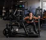Glutebuilder Plate Loaded Glute Lunge side view with woman demonstrating side lunge position